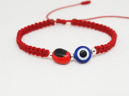 Pulsera Hilo Rojo con Ojo Turco y Cuenta Huayruro (Cerámica) - My Cuqui Shop
